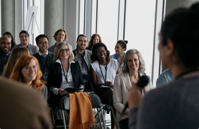 audience watching a speaker