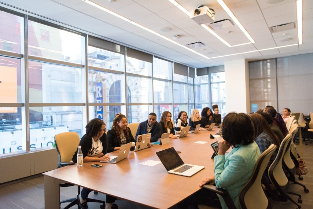 A group of employees during an all-hands meeting.
